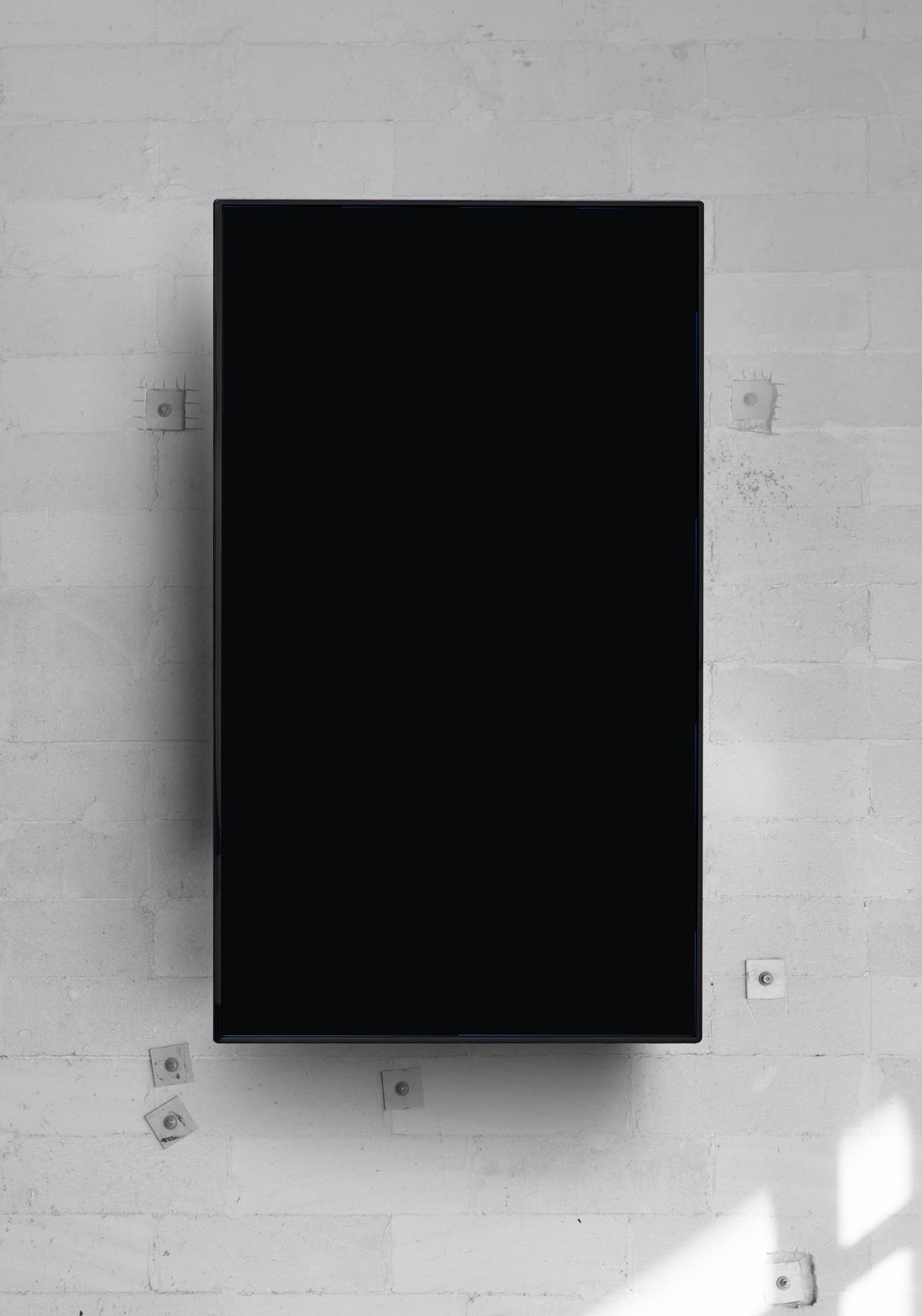 onday digital signage playing on a wall-mounted portrait TV